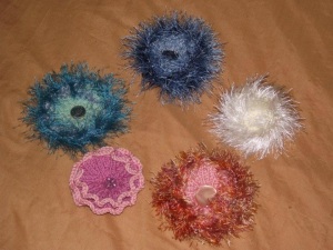 Odds and ends of yarn or fabric can be made into brooches