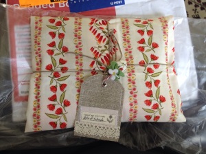 Fabric parcel with lovely handmade gift tag and fabric strawberry attached